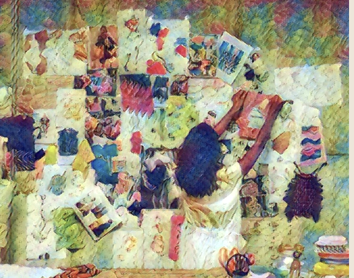 Woman pinning colorful fabric swatches to a wall